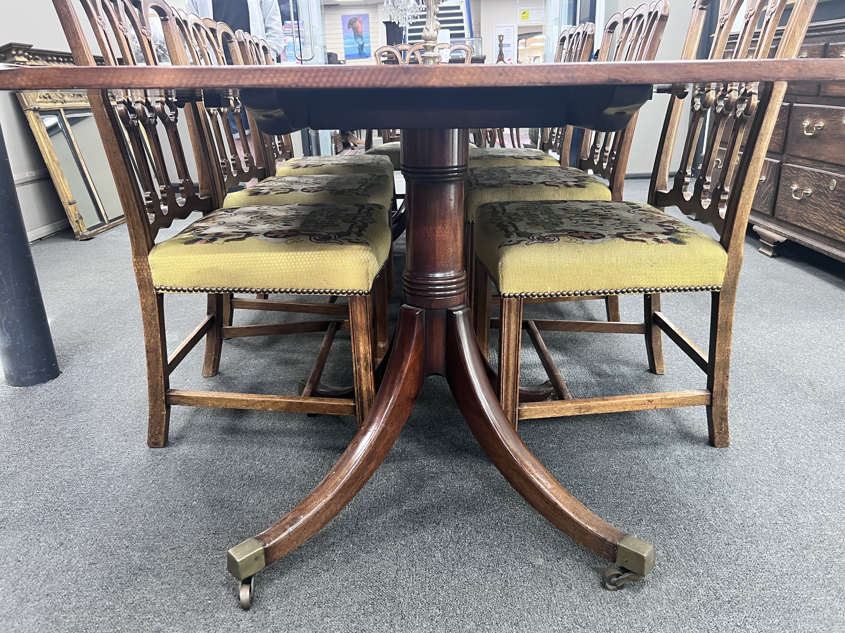 A William IV style mahogany twin pillar extending dining table, length 281cm extended, two spare leaves, width 114cm, height 75cm